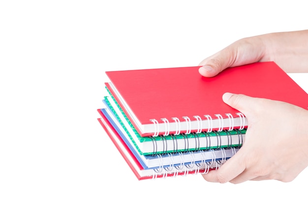 stack of notebooks colorful in hand.