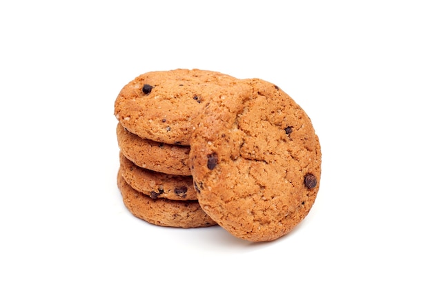 Stack of oatmeal cookies with chocolate pieces isolated on white background