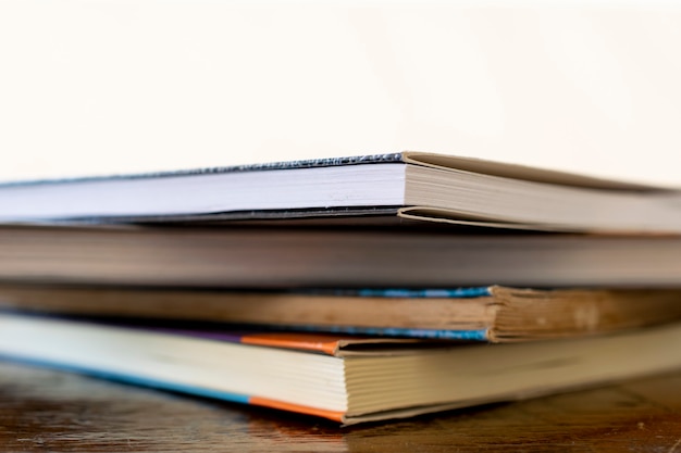 Stack of old books on the table with space for text