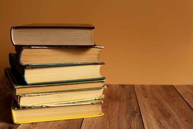 A stack of old books with yellow pages Book binding Knowledge and education