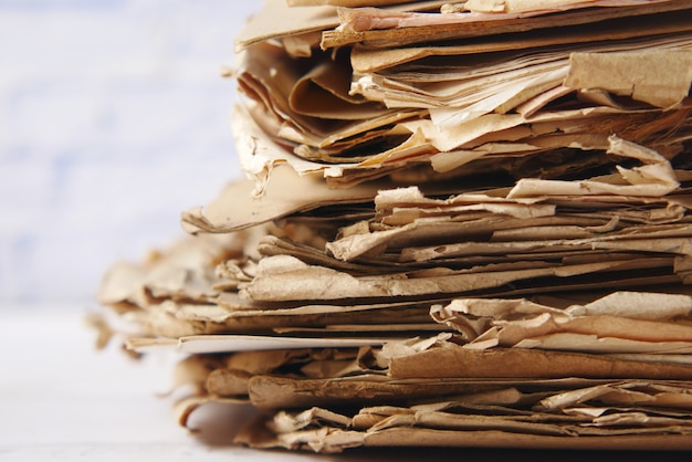 Stack of old papers on table