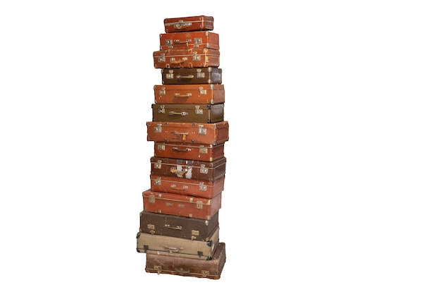 Stack of old retro suitcases isolated on white background