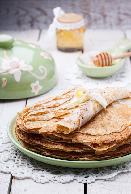 Stack of pancakes with honey 