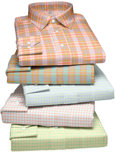 A stack of shirts that say's on the bottom