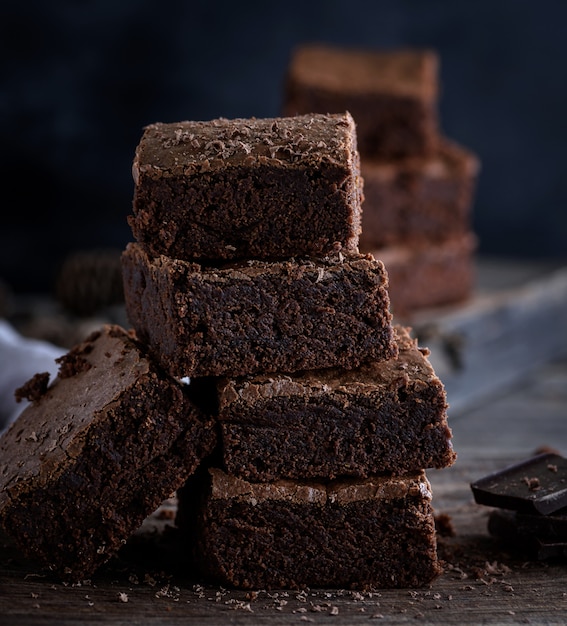  stack of square pieces of baked brown brownie pie