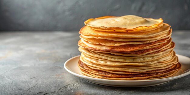 Photo a stack of thin pancakes with a piece of butter on top