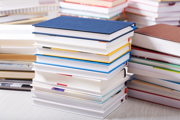 Stack of various books in a library