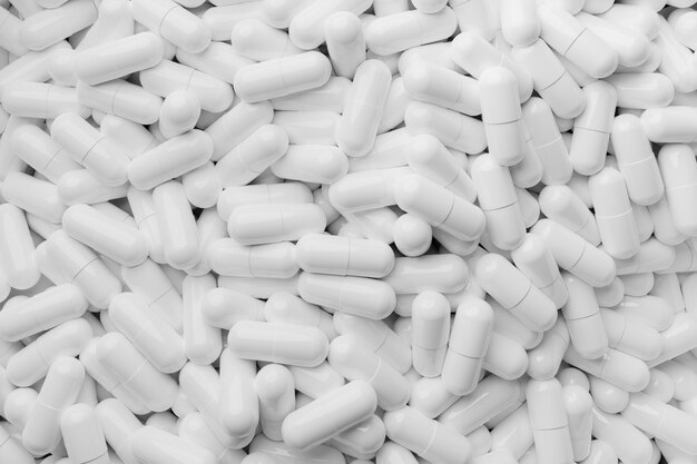 Stack of White capsules close up