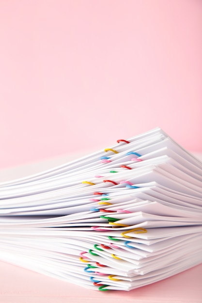 Stack of white paper with clips