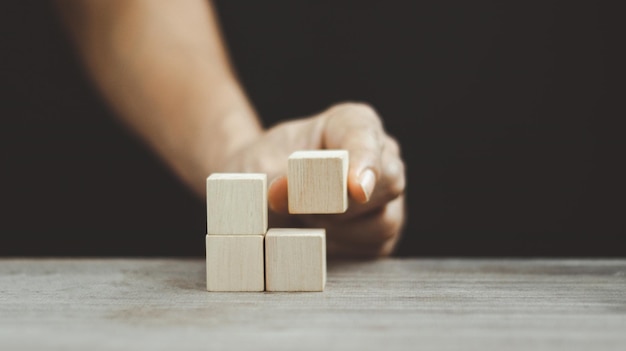 Stack wooden blocks on a dark background