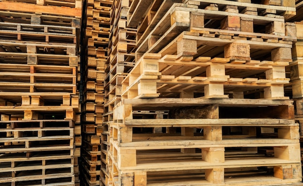 Stack of wooden pallet Industrial wood pallet at factory warehouse Cargo and shipping concept