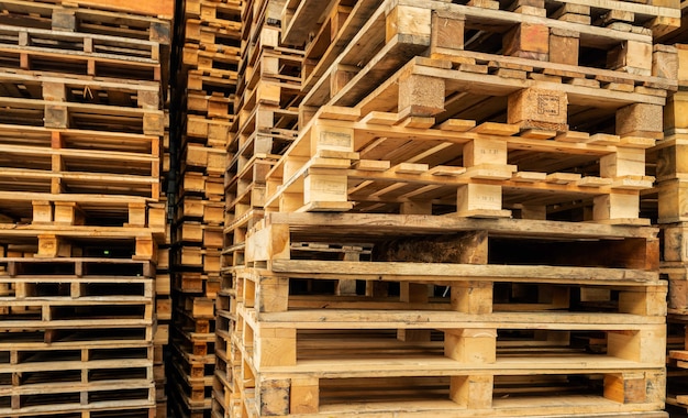 Stack of wooden pallet Industrial wood pallet at factory warehouse Cargo and shipping concept