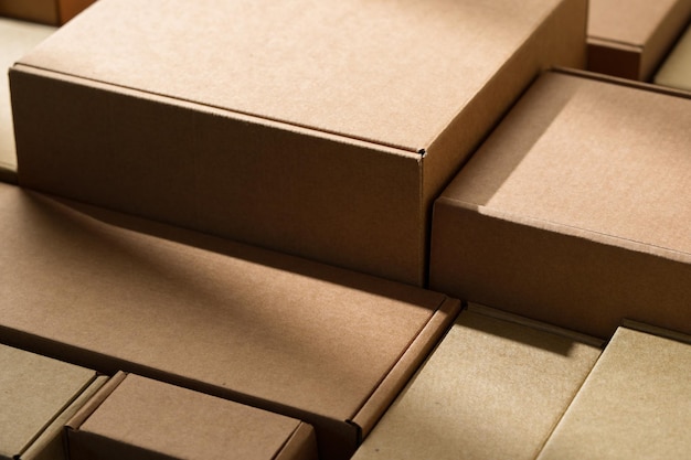 Photo stacked cardboard boxes arranged in a neat pattern under natural light