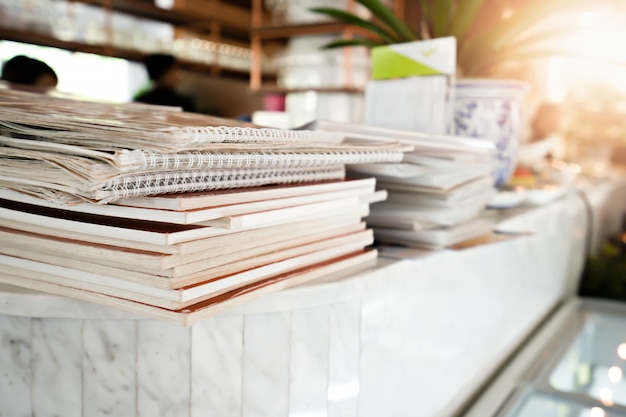 Stacked menu book on table in restaurant