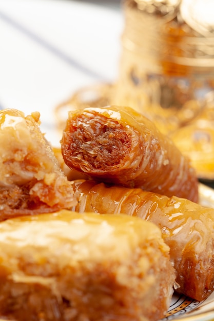 Stacked turkish baklava dessert in a plate close up