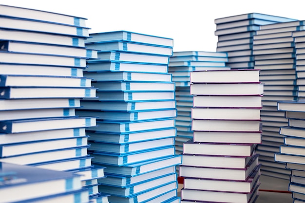 Stacks of books on the table isolated on a white background