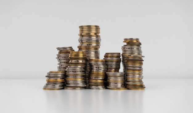 Stacks of coins on a white background