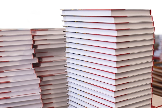 Stacks of hardcover books isolated on a white background