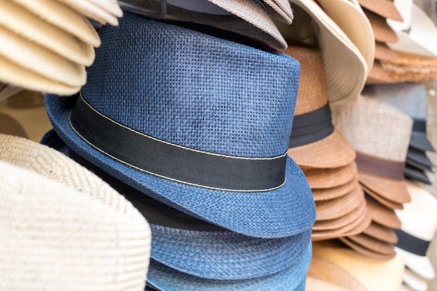 Stacks of mens hats on the street market