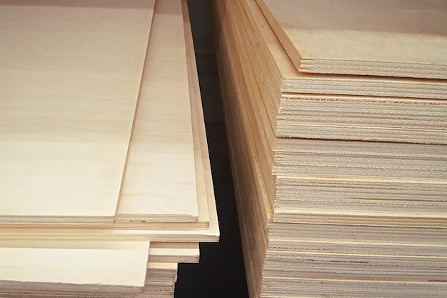 Stacks of plywood for construction in the warehouse. Plywood boards on the industry.