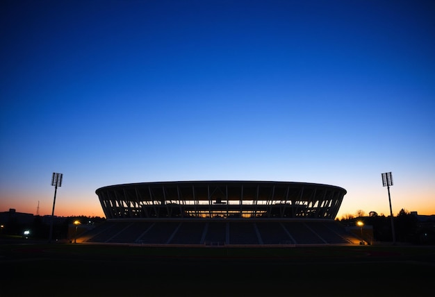 a stadium with a blue sky and a blue sky in the background