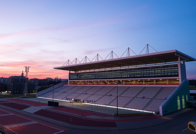 Photo a stadium with a sunset in the background