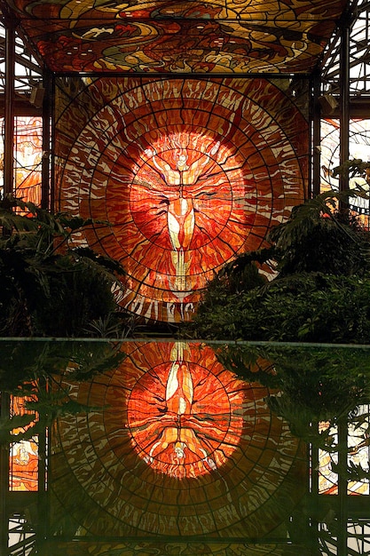 stained glass window cosmovitral in Toluca Mexico colorful stained glass window with human figure