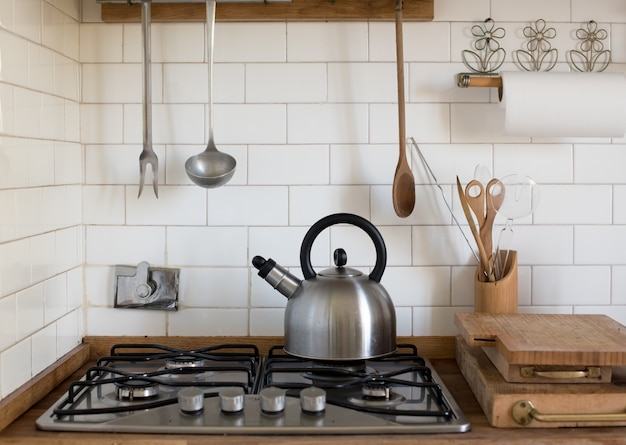 Stainless steel kettle on a gas burner