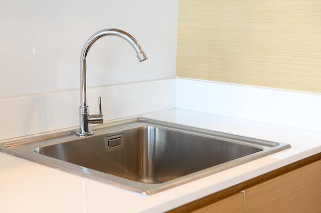 Stainless steel kitchen sink in room