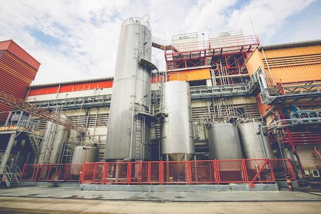 Stainless vertical steel tanks with equipment tank chemical cellar at the with stainless steel silo