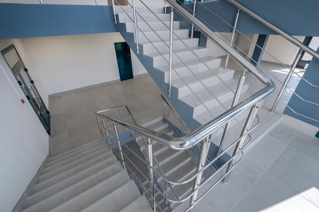 Stairs emergency and evacuation exit stair in up ladder in a new office building