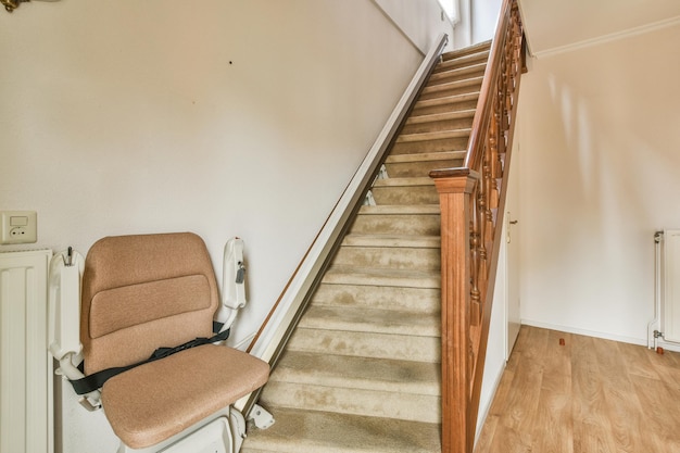 A stairwell with a wheelchair next to a staircase