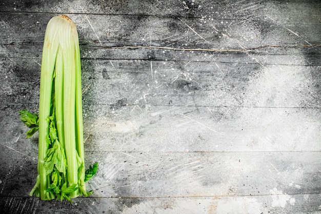 A stalk of fresh celery on the table