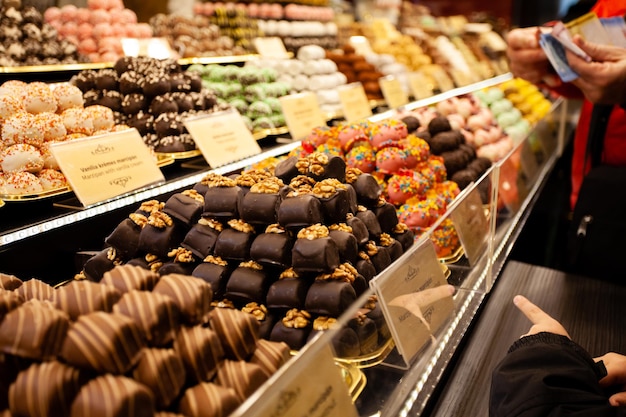 Stall with traditional chocolate festive candies at the Christmas Market in Europe Christmas street market