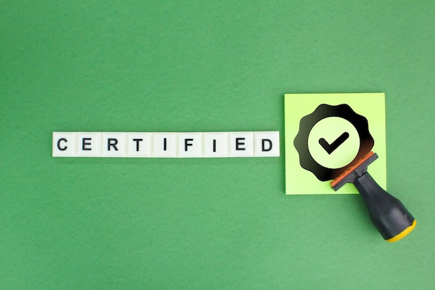 stamp and letters of the alphabet with the word CERTIFIED its icon Standard certification