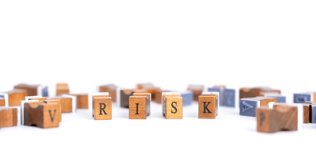 Stamp wooden cube block of risk wording for risk Business and Financial concepts