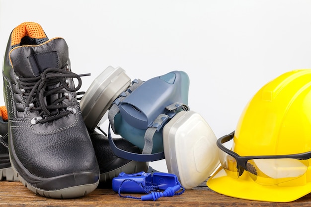 Photo standard construction safety equipment on wood background