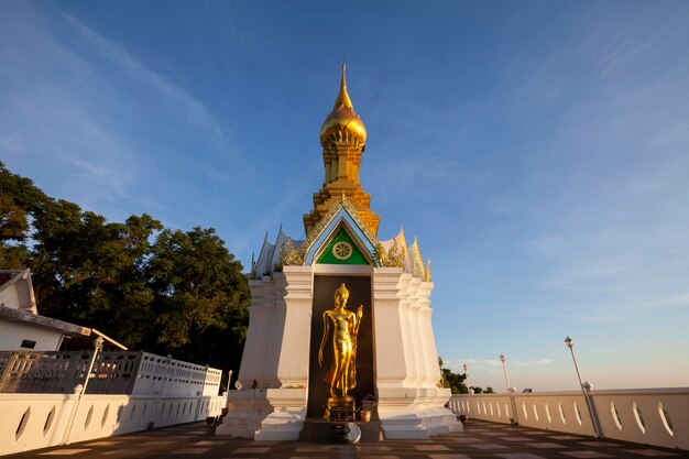 Standing gold Buddha image name is Wat Sra Song Pee Nong in Phitsanulok ThailandxA