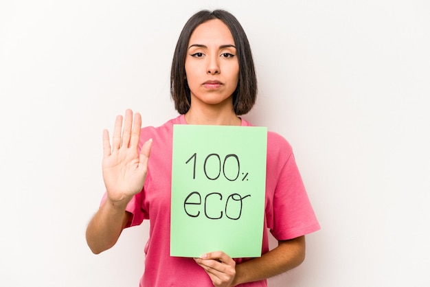 Standing with outstretched hand showing stop sign preventing you