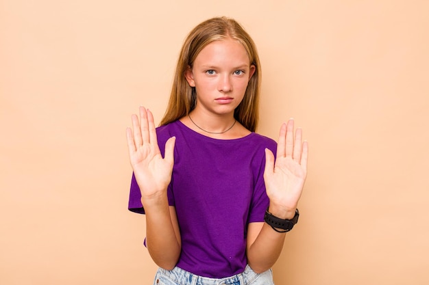 Standing with outstretched hand showing stop sign preventing you