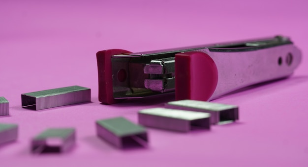 Stapler with pin images on isolated background