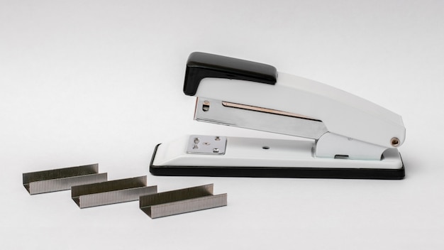 Photo stapler with staples on a white background. office accessories_