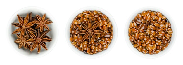 Star anise fruits and seeds in white bowls