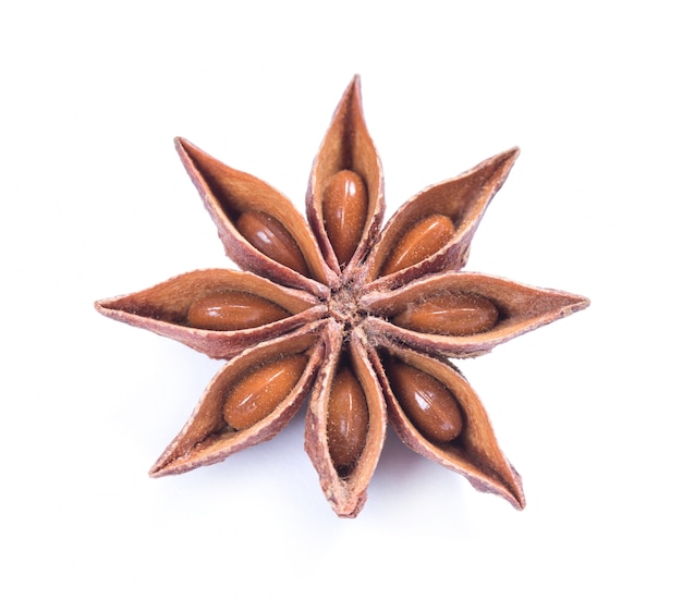 Star anise spice fruits and seeds isolated on white