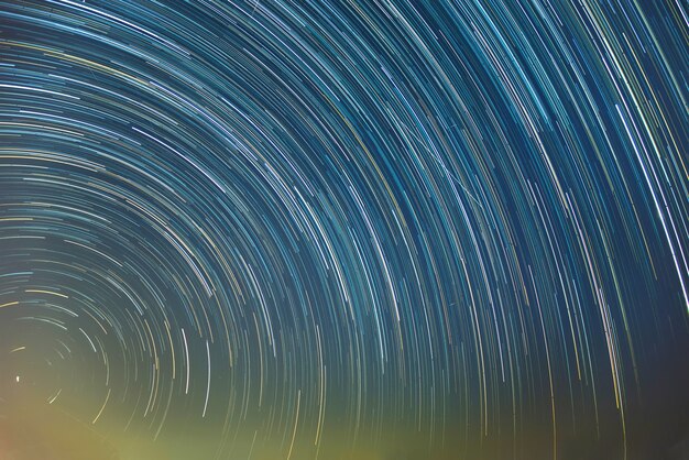 Photo star trails movement at night in thailand.