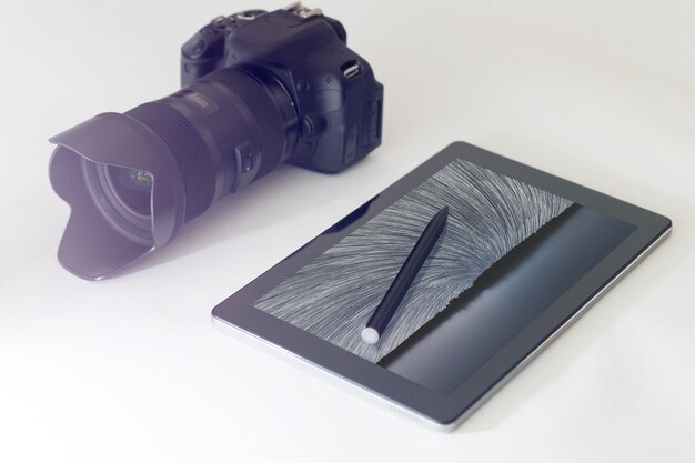 Star trails photography concept, DSLR, digital tablet