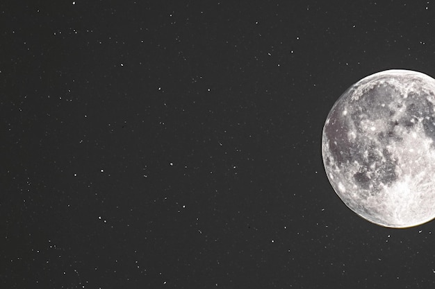 Starry night sky shot with beautiful moon and sparkling stars photograph