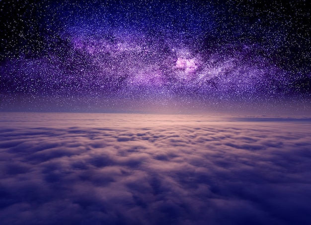 Starry sky above the clouds, mystical magical atmosphere.