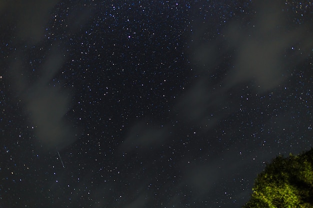 Starry sky on the lake Night landscape Sky with clouds