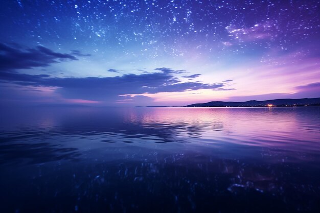 Photo a starry sky with the stars above the water